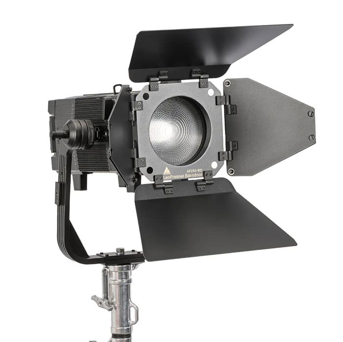 Astera Kit of 1 LeoFresnel with Lens, Barndoor, Yoke, YokeBase, TVMP Adapter, TrackHandle and Powercon Cord stored in a durable protective plastic case with wheels and handle image 1